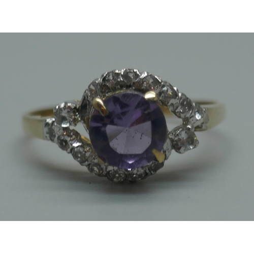 914 - A yellow metal, amethyst and white stone cluster ring with continental marks, 1.8g, O