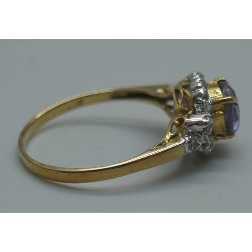 914 - A yellow metal, amethyst and white stone cluster ring with continental marks, 1.8g, O