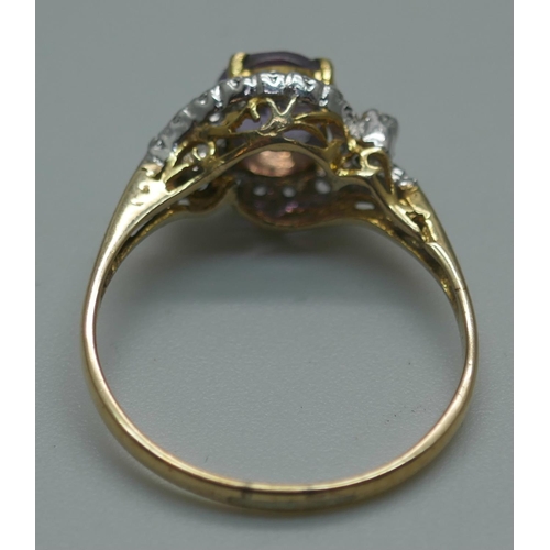 914 - A yellow metal, amethyst and white stone cluster ring with continental marks, 1.8g, O