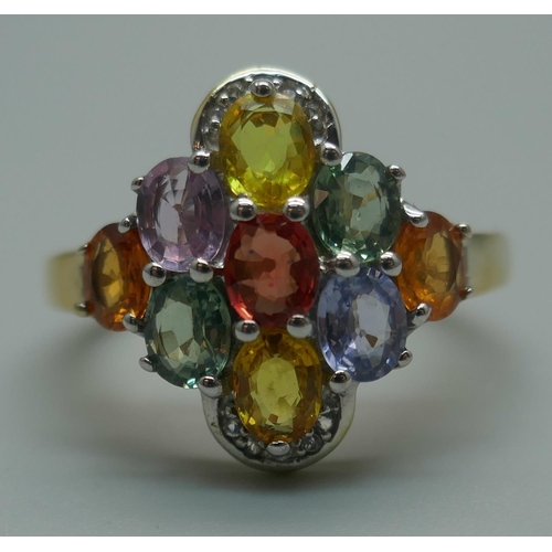 915 - A silver gilt, multi-colour sapphire and white topaz cluster ring, T/U