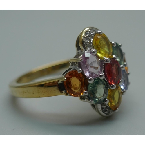 915 - A silver gilt, multi-colour sapphire and white topaz cluster ring, T/U