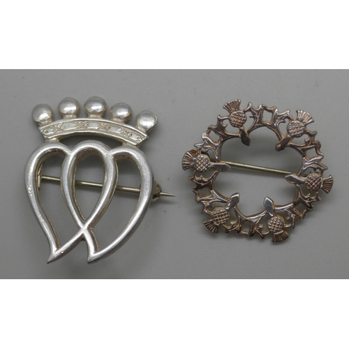 923 - A Scottish silver Luckenbooth brooch by Thomas Kerr Ebbutt and a silver thistle brooch