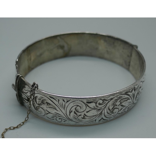 925 - An engraved silver bangle, 47g