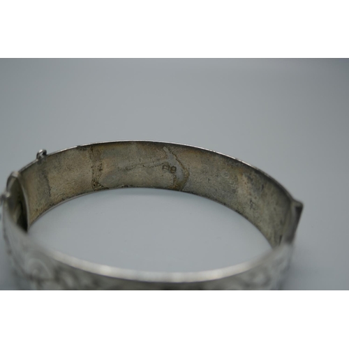 925 - An engraved silver bangle, 47g