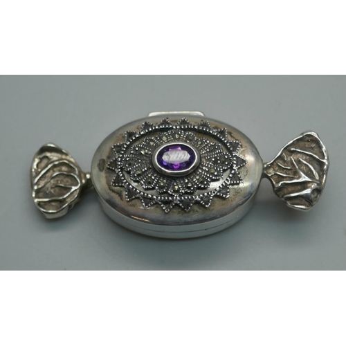 928 - A novelty silver gem set pill box in the form of a sweet