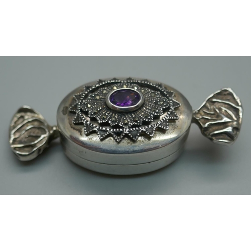 928 - A novelty silver gem set pill box in the form of a sweet