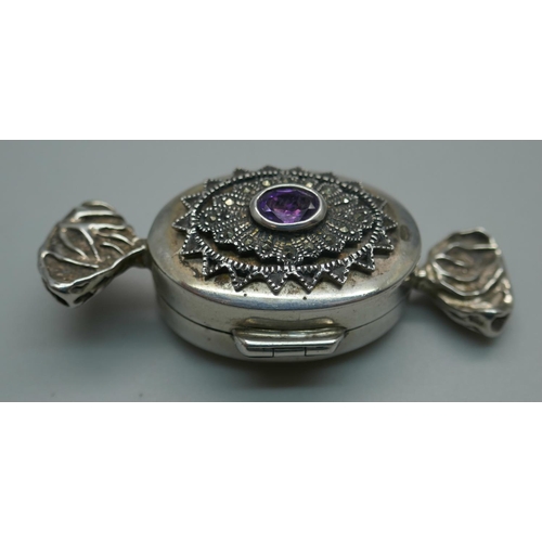 928 - A novelty silver gem set pill box in the form of a sweet