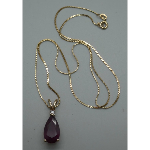 929 - A 9ct gold and ruby pendant on a 14ct gold chain, 4.4g