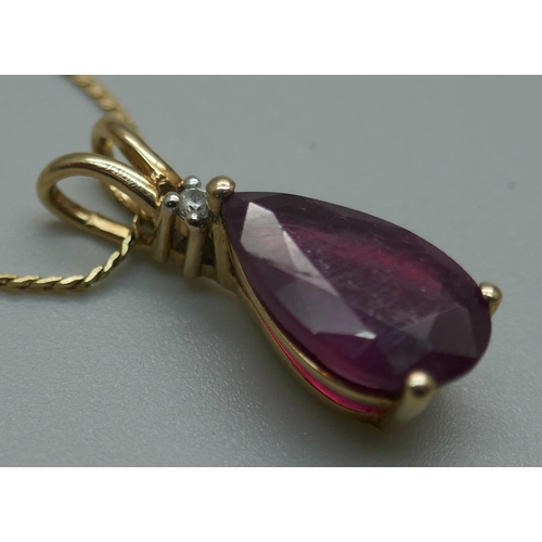 929 - A 9ct gold and ruby pendant on a 14ct gold chain, 4.4g