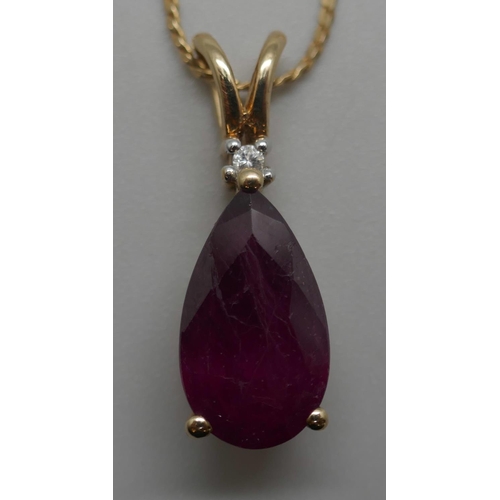 929 - A 9ct gold and ruby pendant on a 14ct gold chain, 4.4g