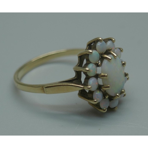 941 - A 9ct gold and opal cluster ring, 2.2g, M