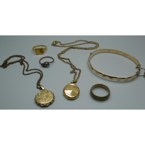 945 - A 9ct gold metal core bangle, two rolled gold lockets, etc.