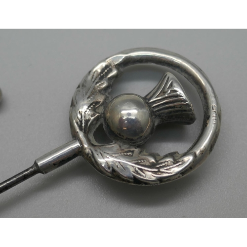 950 - A silver hat pin and a lady's Albertina