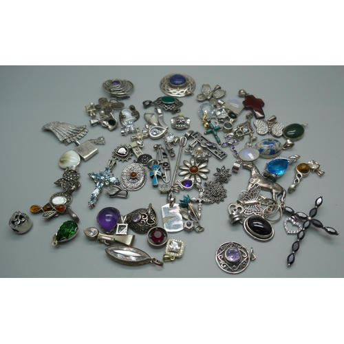 953 - A collection of silver pendants