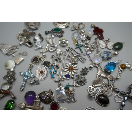 953 - A collection of silver pendants