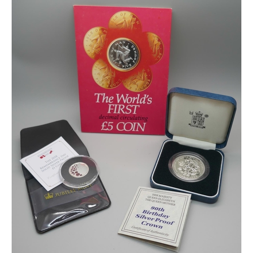 956 - A £5 coin, The World's First decimal circulating £5 coin, a £1 silver proof Remembrance Day 2018 coi... 