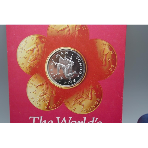 956 - A £5 coin, The World's First decimal circulating £5 coin, a £1 silver proof Remembrance Day 2018 coi... 