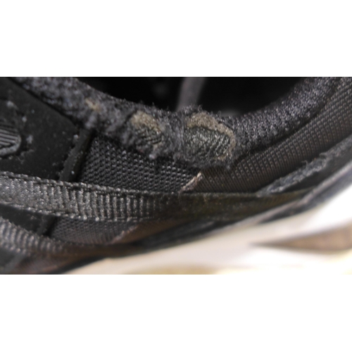 3144 - A pair of Puma black Setona V12 trainers (size UK 6) * This lot is subject to VAT