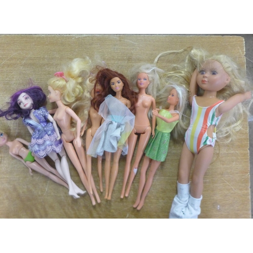 2304 - A bag of assorted dolls including Barbie