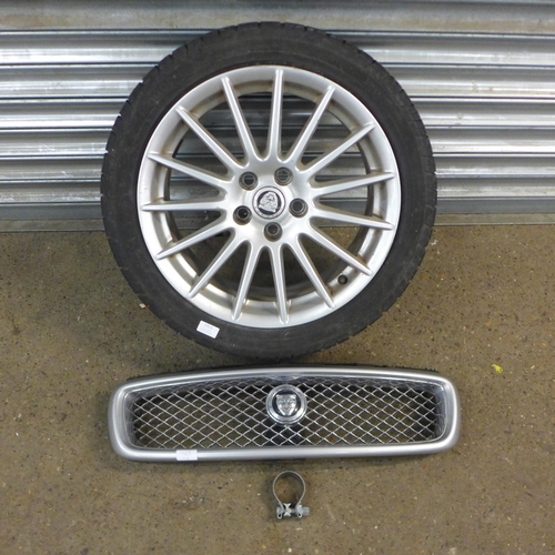 2313 - A single Jaguar alloy wheel and tyre with a Jaguar grill