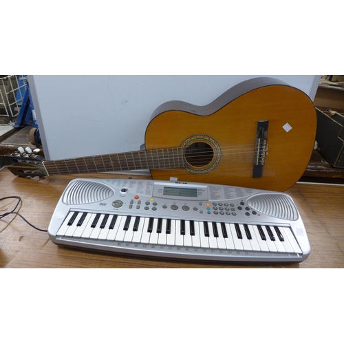 2083 - An electric keyboard (MC-36) and a KC 333 acoustic guitar