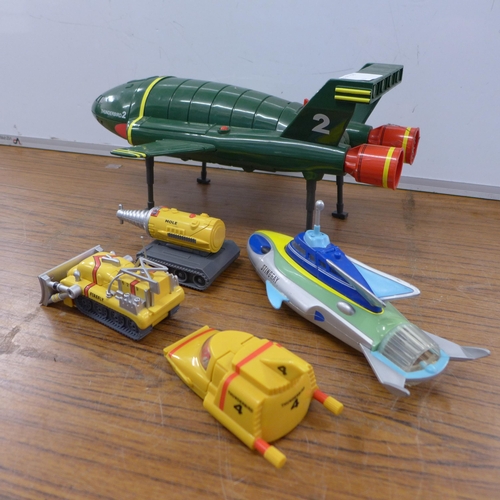 2099 - A selection of plastic Thunderbird models including Thunderbird 2, Thunderbird 4, The Mole, Firefly ... 