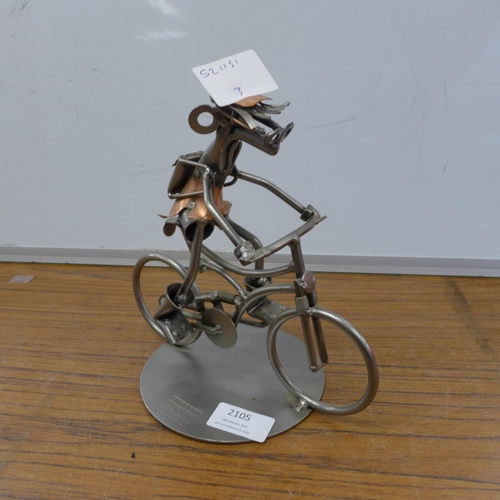 2105 - A Hinz & Kunst metal figurine, man on bicycle