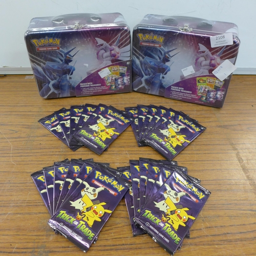 2108 - Two Pokémon Trading Card Game booster packs and 24 packs of Pokémon Trick or Trade Pokémon cards