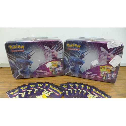 2108 - Two Pokémon Trading Card Game booster packs and 24 packs of Pokémon Trick or Trade Pokémon cards