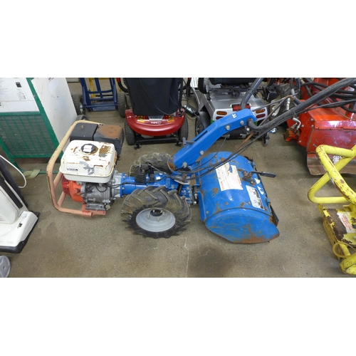 2180 - A Camon Tracmaster petrol powered rotavator/cultivator with a Honda GX240 petrol engine