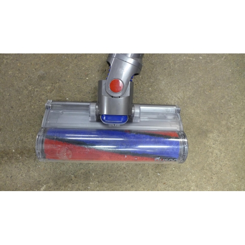 2213 - A Dyson V8 vacuum cleaner with motorised hard floor brush- no charger - W