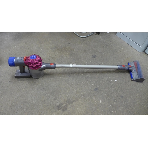 2214 - A Dyson V8 vacuum cleaner with motorised hard floor brush- no charger - W