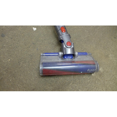 2214 - A Dyson V8 vacuum cleaner with motorised hard floor brush- no charger - W