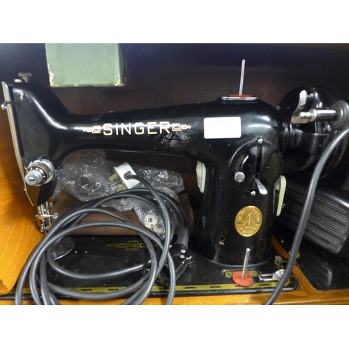 2427 - A vintage Singer electric sewing machine in case