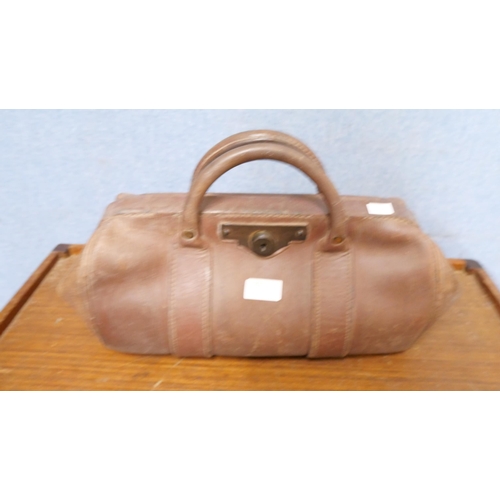 297 - A leather Gladstone bag