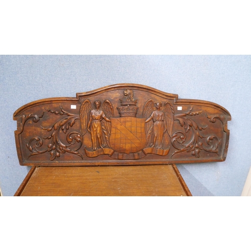 306 - An armorial carved oak plaque