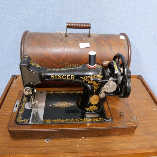 311 - A cased Singer sewing machine