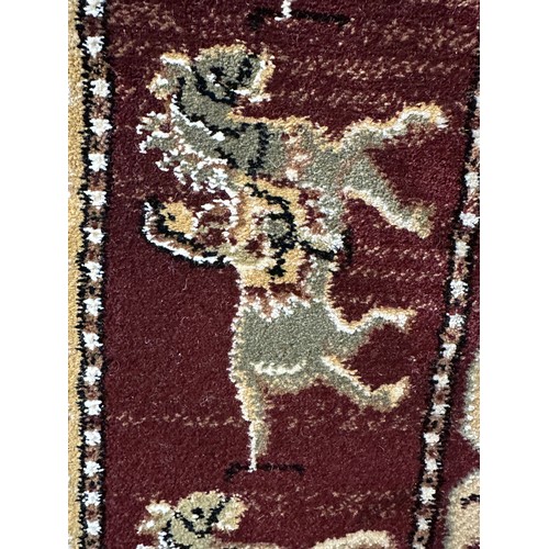 1430A - A fine woven 100% wool pile rug, unique all over design with animal figures 130 x 195cm