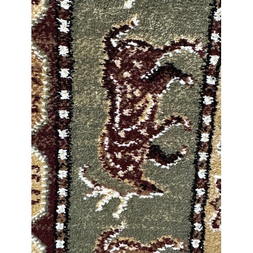 1430A - A fine woven 100% wool pile rug, unique all over design with animal figures 130 x 195cm