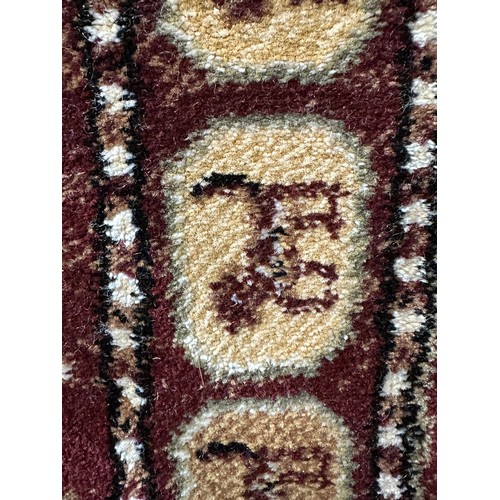 1430A - A fine woven 100% wool pile rug, unique all over design with animal figures 130 x 195cm