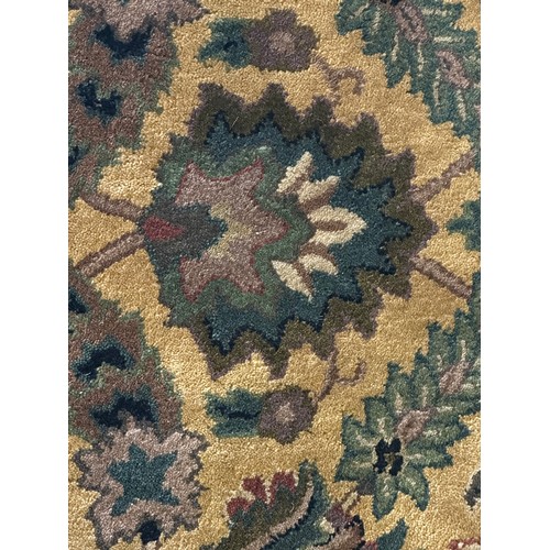 1459A - An ivory ground full pile Cashmere rug with floral medallion design, 170 x 120cm