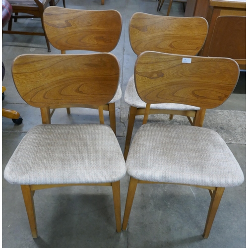 35 - A set of four Beautility teak and elm dining chairs