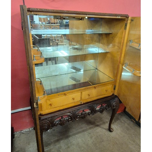 99 - A Queen Anne style burr walnut cocktail cabinet