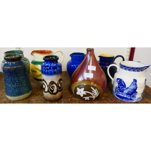 307 - Eight large jugs and vases, including West German, Denby and Moorland Chelsea Works