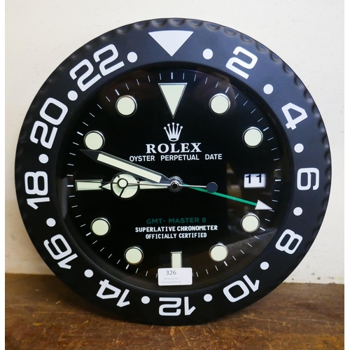 326 - A Rolex style dealers display wall clock