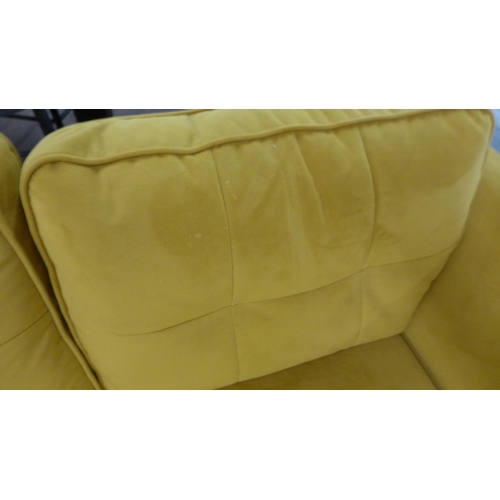 1314 - A turmeric velvet two seater sofa