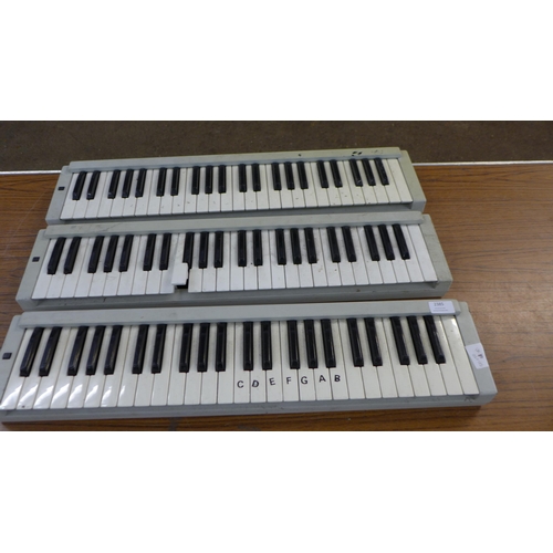 2139 - Three music keyboards; a Novel CMK49, a Studio 49 and one other