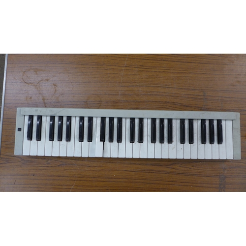 2139 - Three music keyboards; a Novel CMK49, a Studio 49 and one other