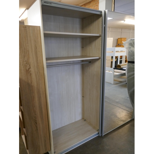 1474 - A large sliding mirrored door wardrobe * this lot is subject to VAT