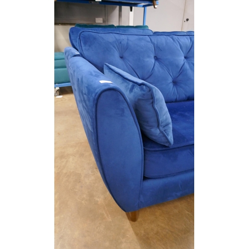 1546 - A Hoxton blue velvet three seater sofa - slight damage